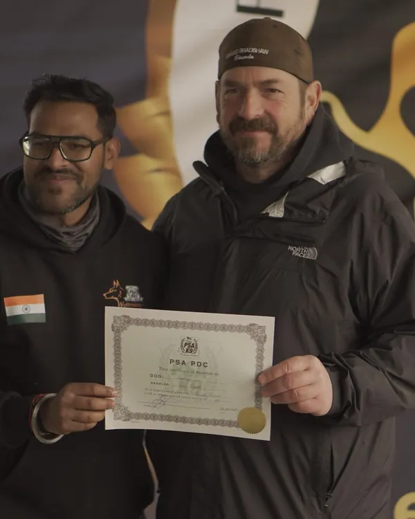This is the goal: a title from a respected organization. Here I am receiving the PSA PDC certificate for my Dutch Shepherd, Angel, after she passed her trial with excellent marks.