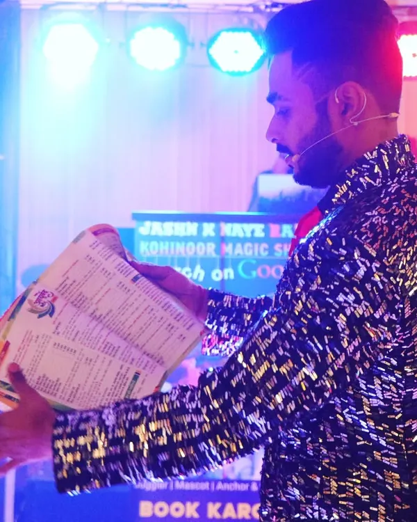 On stage, under the bright lights, I perform a classic book illusion. This trick always baffles the audience, as pictures and words magically appear on blank pages right before their eyes. It's a testament to the power of stage magic.