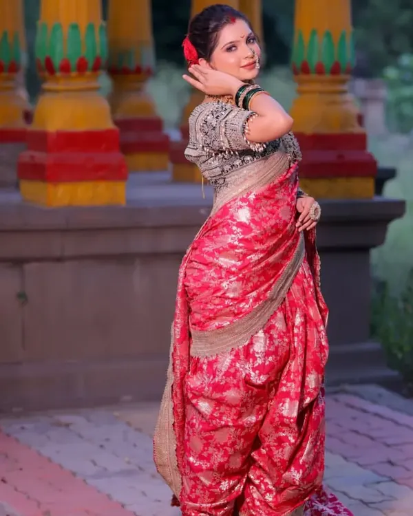 A client looking graceful in a traditional pink Navvari saree. This nine-yard wonder is perfect for bringing Maharashtrian heritage to life at any celebration.