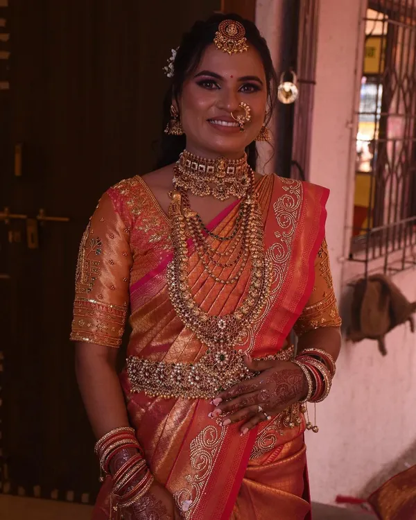 This beautiful bride is ready for her big day. I pre-pleated her stunning South Indian bridal saree, paying close attention to the layers of temple jewelry she would be wearing to ensure a comfortable and regal fit.
