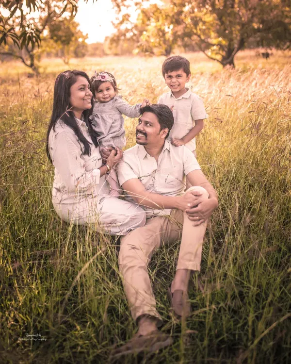 Relaxing in a field of gold. This outdoor family portrait has a warm, rustic feel that is both timeless and authentic.