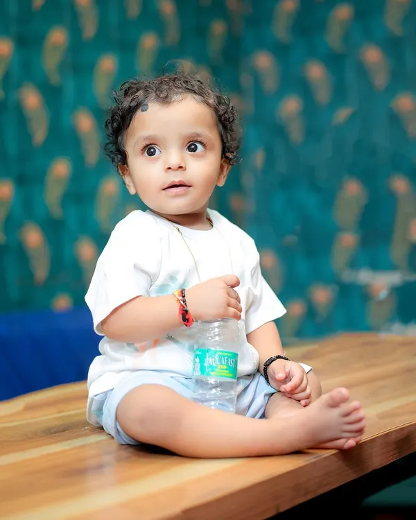 A simple, candid portrait of a baby boy during his birthday shoot. His wide-eyed, curious expression is what makes this shot so special.