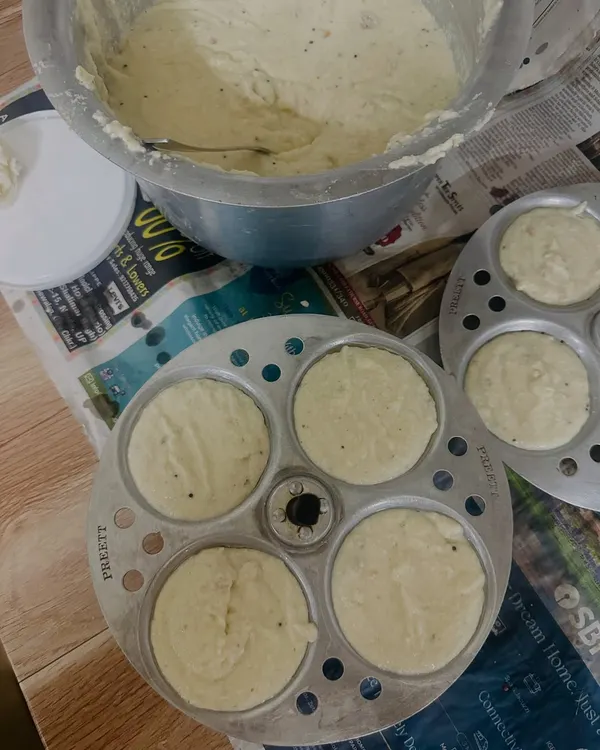 Preparing the batter for our soft and fluffy idlis. We ferment it naturally to get that authentic South Indian taste and texture.