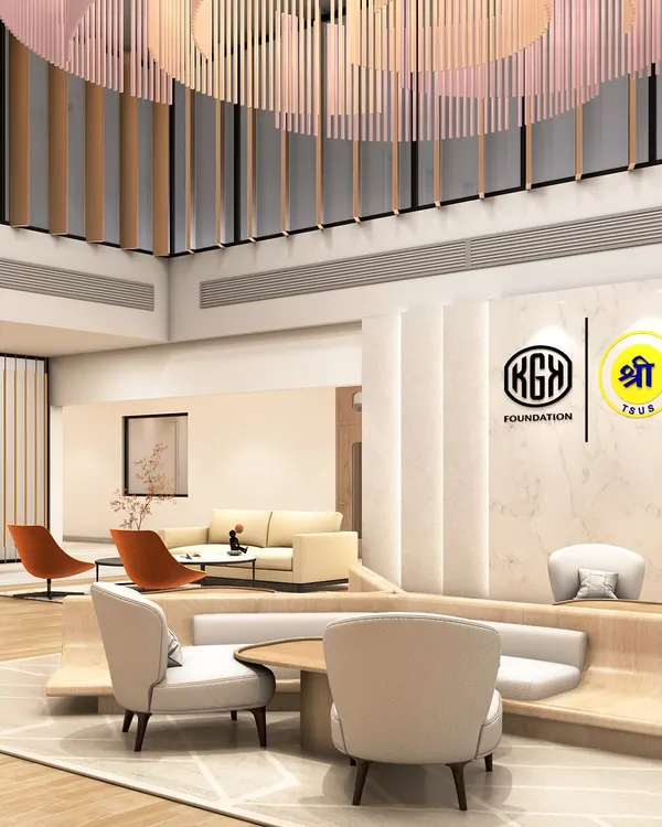 A view of the double-height waiting area in Jaipur, showcasing the interplay of light, volume, and texture. The design uses suspended wooden fins and built-in seating to create distinct zones within the larger open space, balancing grandeur with intimacy.