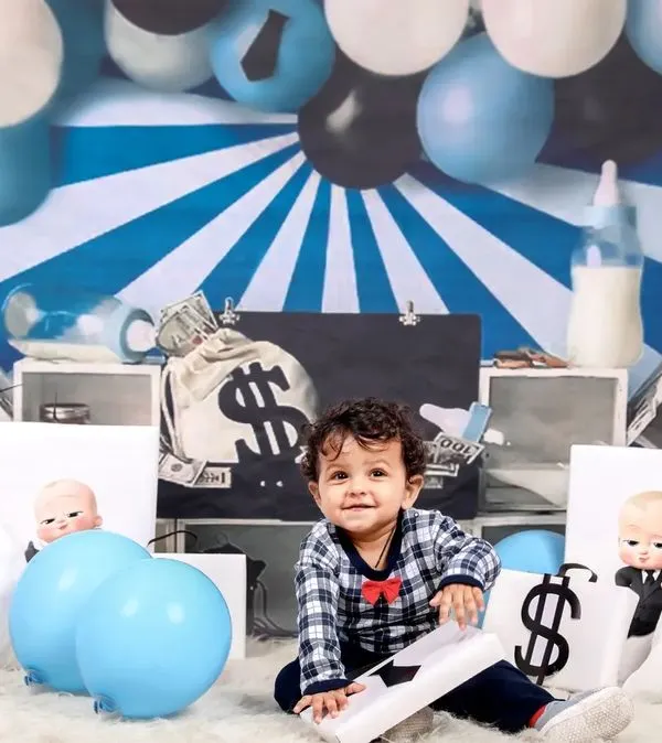 Who's the boss? This little guy is, in our popular 'Boss Baby' themed photoshoot. We provide all the props, including money bags and a tiny briefcase, for a fun and powerful portrait.