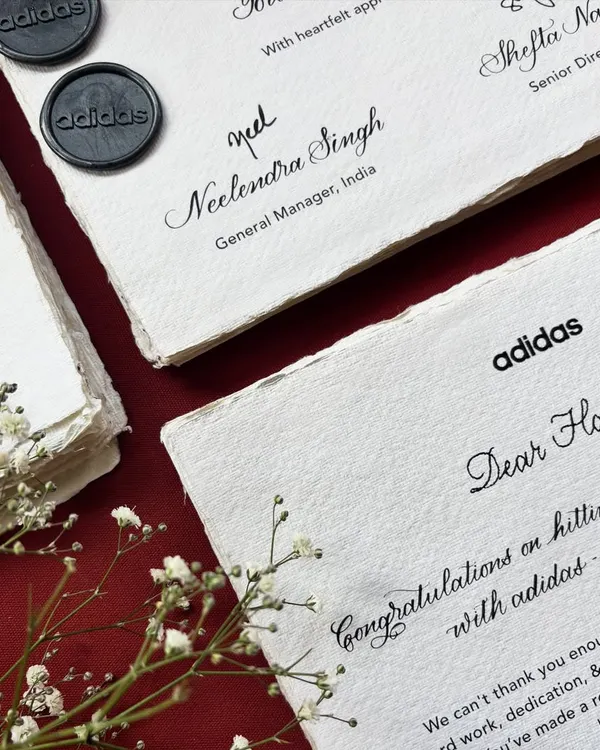 A throwback to a thoughtful project for Adidas India, honoring team members hitting incredible milestones. Over 75 notes were crafted on handmade paper, combining typed font with digital calligraphy, and then individually hand-addressed.
