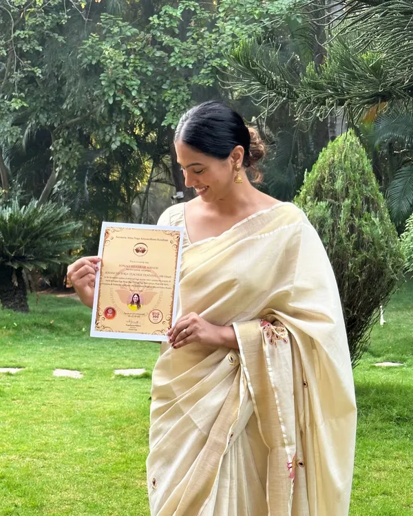 A proud moment holding my 500-hour advanced yoga teacher training certificate. This qualification represents a deep dive into yoga philosophy, anatomy, and advanced teaching methodologies.