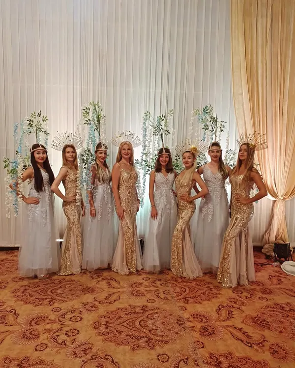 Our team of Russian artists available for hire. Dressed in elegant gold and silver gowns, they serve as hostesses, adding a touch of international sophistication to weddings and corporate events.