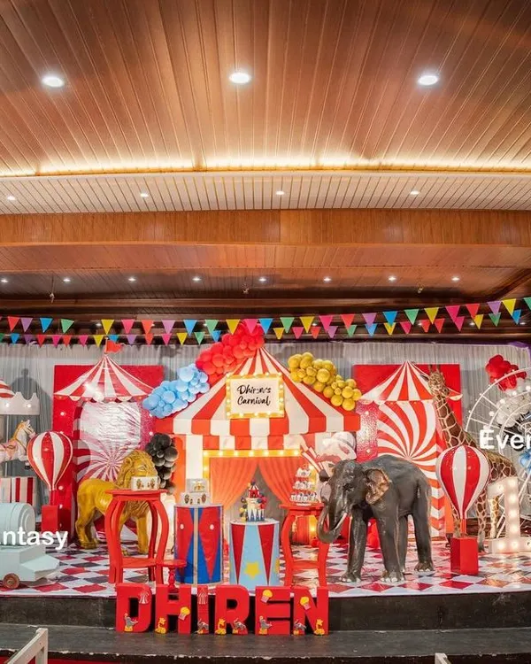 Step right up to Dhiren's grand carnival party. This vibrant indoor stage is filled with classic carnival elements, including a red and white striped big top, a carousel, a Ferris wheel, and friendly animal props, creating an atmosphere of fun and excitement for everyone.