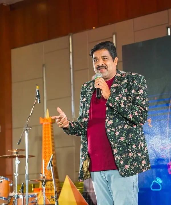 On stage at the Gulf Oil 'Unlock' event. As a corporate event emcee, I focus on keeping the energy high and the program running smoothly for all the attendees.