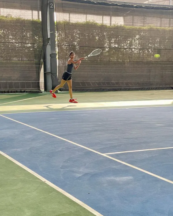 A young athlete perfecting her forehand during a training session on our professional-grade hard courts. We focus on developing strong technical skills and powerful form from an early age.