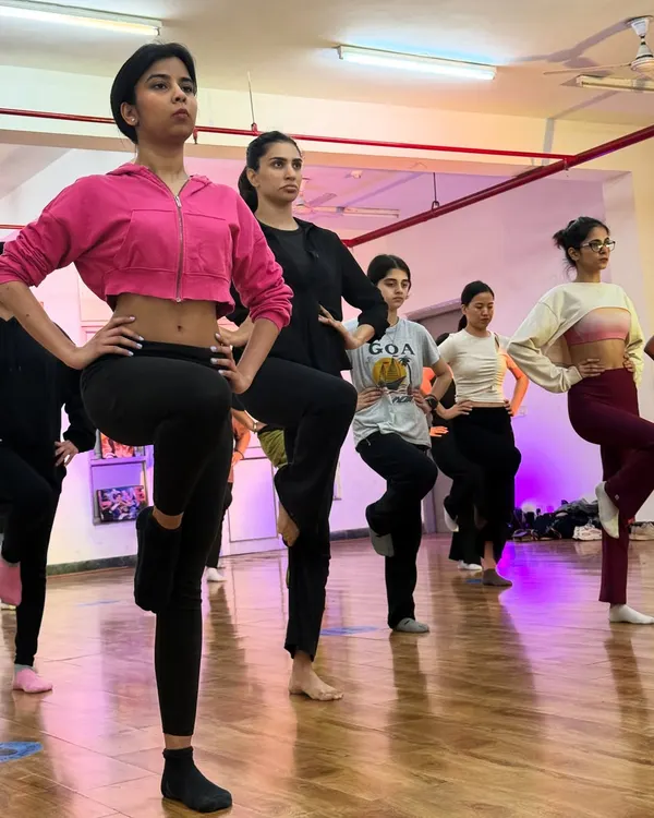 We start every class with a proper warm up and technical drills, like this balancing exercise. Building a strong foundation in jazz technique is key to improving your dance skills.