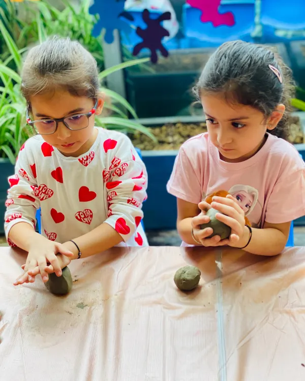 Two young artists working together on their clay Ganeshas for our Ganesh Chaturthi workshop. Our workshops are a wonderful way for kids to learn about cultural traditions through hands-on art.