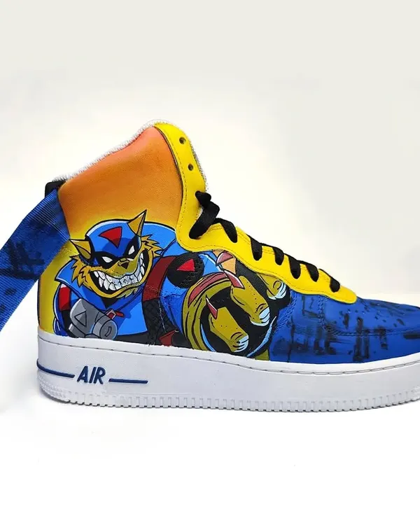 A fully painted pair of Nike Air Force 1s featuring the SWAT Kats. This maximalist design is a throwback to the iconic 90s cartoon, bringing Bade Meow and Chhote Meow to life.