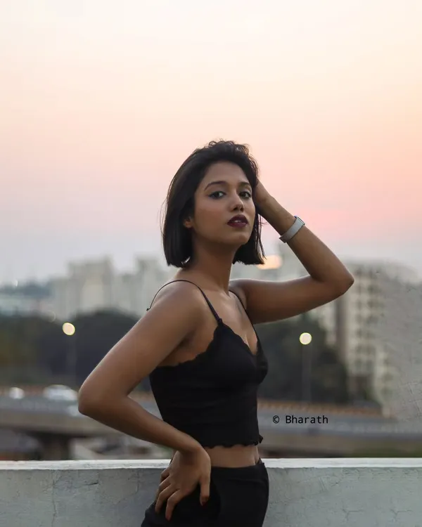 This is the kind of urban portrait I love to create, using the golden hour light against the Bangalore city skyline for a modern and atmospheric feel.