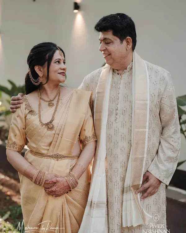 A beautiful moment between the bride's parents. I had the pleasure of doing the makeup for the bride's mother, focusing on a graceful and radiant look that complemented her elegant golden saree.