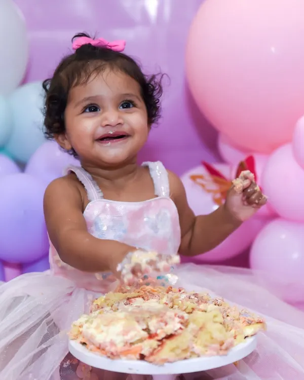 This is what pure joy looks like. We love capturing the genuine, happy smiles of a first birthday cake smash, creating a memory that's as sweet as the cake itself.