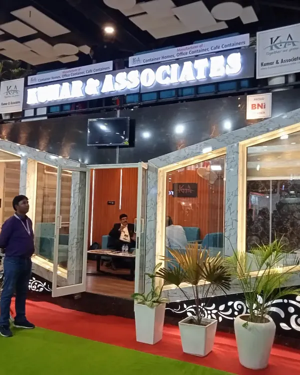 A complete view of our modular exhibition stall, highlighting the illuminated branding and the seamless integration of large window panels. We ensure every structure is built to represent your brand with the utmost quality and professionalism.