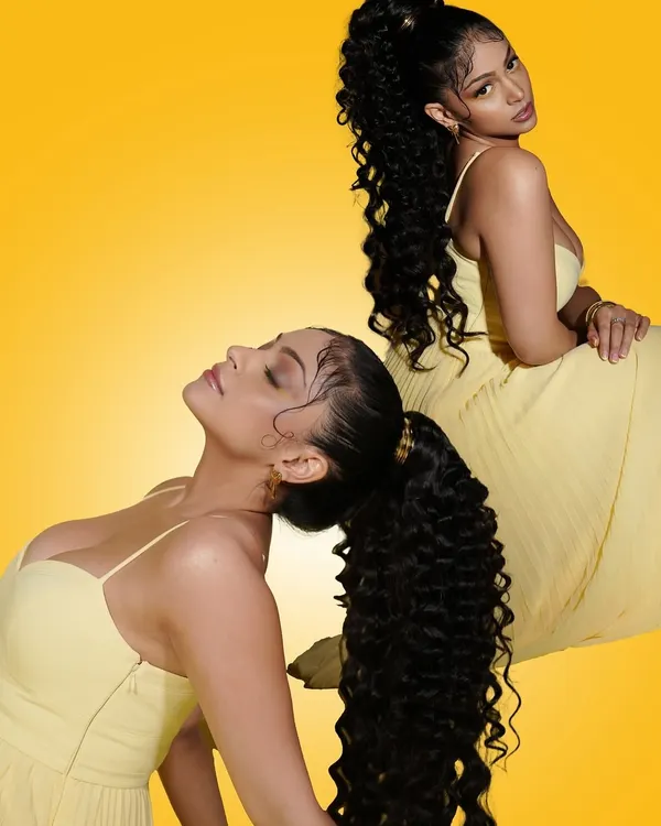 A playful and artistic shot from our Summer Edit campaign. This look features a high curly ponytail and creative eye makeup, showcasing our ability to create trendy, high-fashion looks.