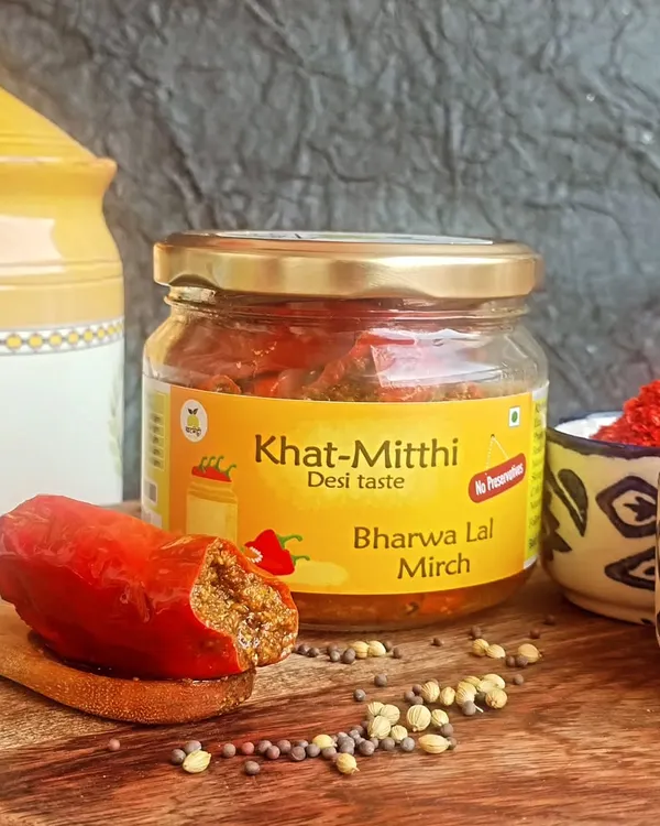 This is my family's special Bharwa Lal Mirch ka Achaar. Each red chilli is carefully stuffed with a masala that I grind at home, using my dadi's secret recipe. It’s the authentic taste of Bihar, made with less oil so you can enjoy the true flavour of the spices.