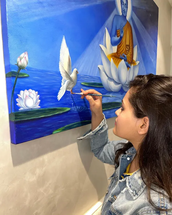 This is me with one of my favorite personal pieces. Painting is my meditation, and I started Brushstrokes to share that feeling of peace and joy with others. I truly believe everyone has an artist inside them.