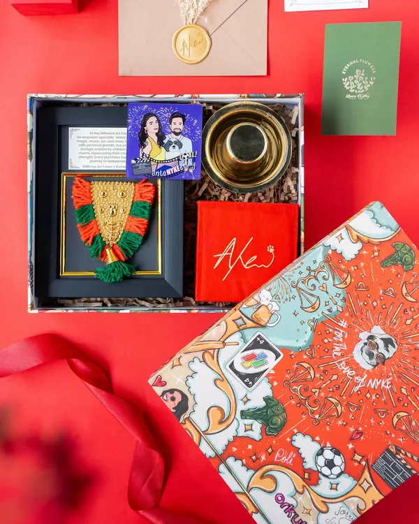 This bespoke wedding return hamper, created for actress Keerthy Suresh, tells a unique love story through custom doodle art. It features a personalized box, a handcrafted Nettipattom made by differently-abled children, and other keepsakes, showing how I blend personal stories with meaningful details.