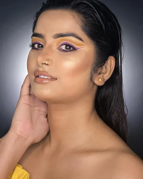 A professional portfolio look featuring a colorful graphic eyeliner. This is the kind of high-impact, clean work we train our students to produce for their own professional portfolios.