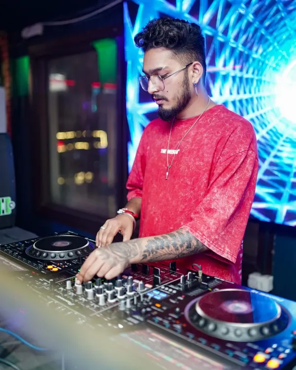 In my element, crafting the perfect mix. This is where I connect with the music and the crowd, creating a vibe that takes over the entire club.