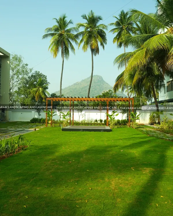 I designed this residential garden to be a true escape, blending a modern wooden pergola and a vast, manicured lawn with the natural beauty of the surrounding hills. This is where architecture and nature meet to create a private paradise.