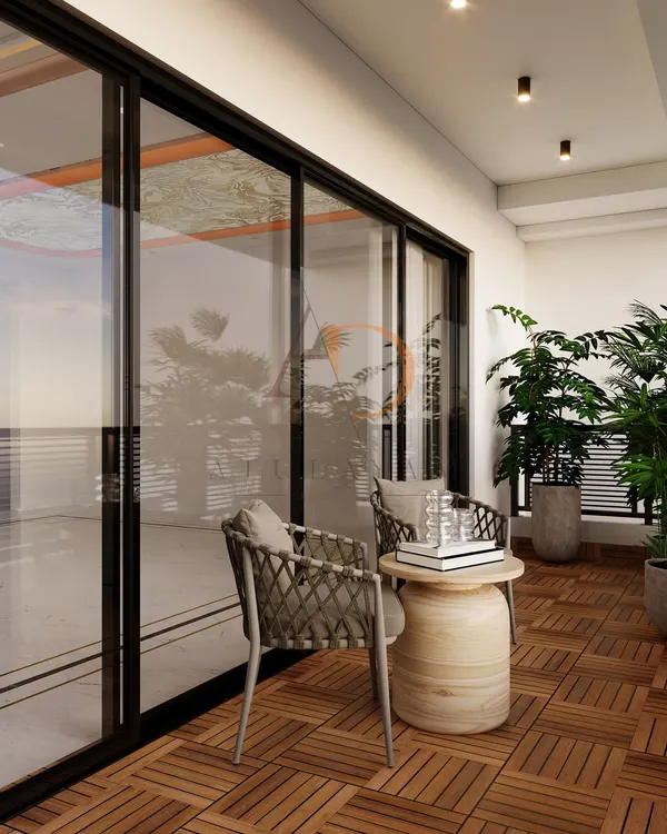 A cozy balcony with wooden deck tile flooring, comfortable rope-woven chairs, and lush potted plants creating a private urban oasis.