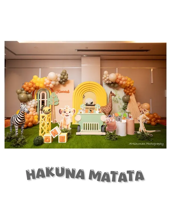 We specialize in bringing epic stories to life, like this 'Hakuna Matata' Lion King party. This wide view shows our custom multi-panel backdrops, life-sized animal props including a zebra and Pumbaa, and a safari jeep cake stand, all designed to transport your guests to the Pride Lands.