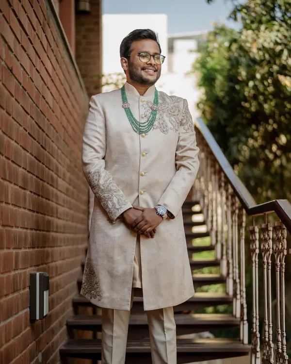 A portrait of the groom in his elegant sherwani, looking sharp and ready for the big day. We make sure the groom's style is captured with sophistication.