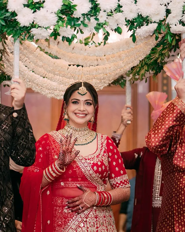The moment everyone waits for. We capture the bride's grand entrance under the phoolon ki chadar, a walk filled with anticipation, love, and the blessings of her family.
