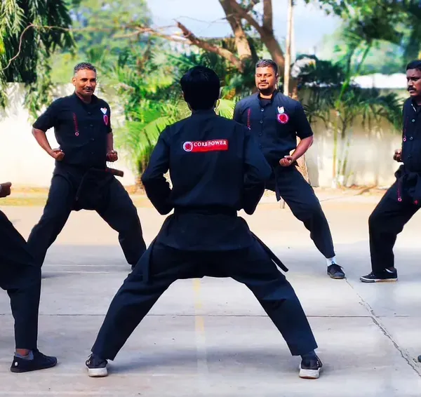 Our senior students and instructors practicing a form in a circle. This demonstrates the teamwork and mutual respect that defines our advanced training sessions.