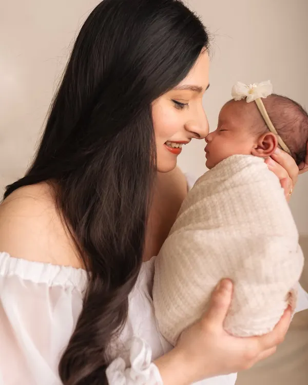 The first few days are pure magic. This close-up from a newborn session captures the tender connection between a mother and her sleeping baby, a memory to hold onto forever.