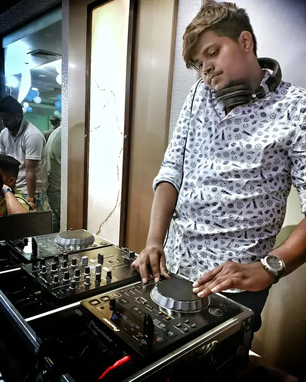In the zone, mixing tracks and feeling the music. My focus is always on the crowd, adjusting the playlist in real time to match the energy of the room and keep the party going strong.