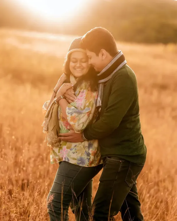 I believe the best light for capturing love is the sun's golden farewell. This intimate moment between an expecting couple, wrapped in the warm glow of sunset in a quiet field, is the kind of timeless, romantic memory I strive to create.