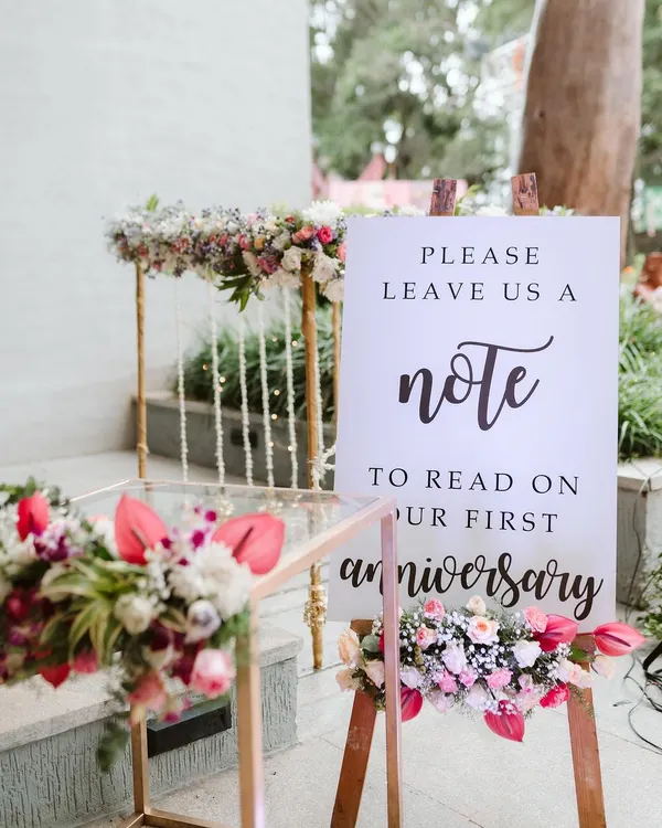 I love this heartwarming idea from a creative couple. We set up a station with a sign asking guests to leave a note for them to read on their first anniversary, creating a beautiful keepsake from their special day.