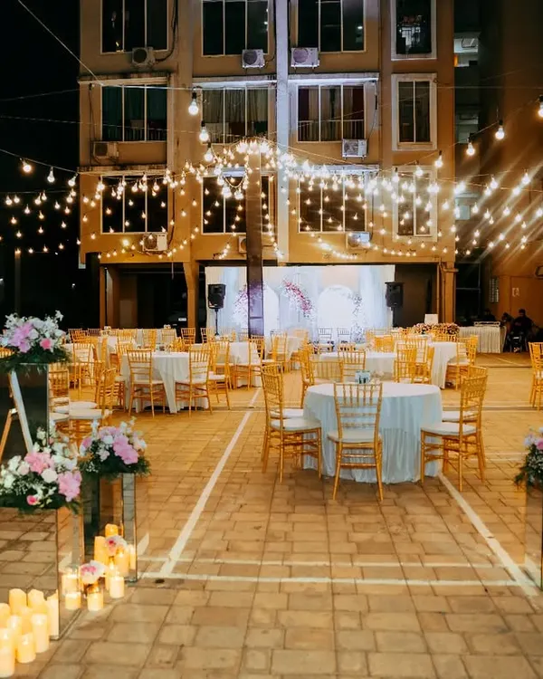 We transformed this residential building's courtyard into an enchanting wonderland for a 78th birthday. With a canopy of fairy lights and elegant decor, we prove that any space can become the perfect venue for your most cherished celebrations.