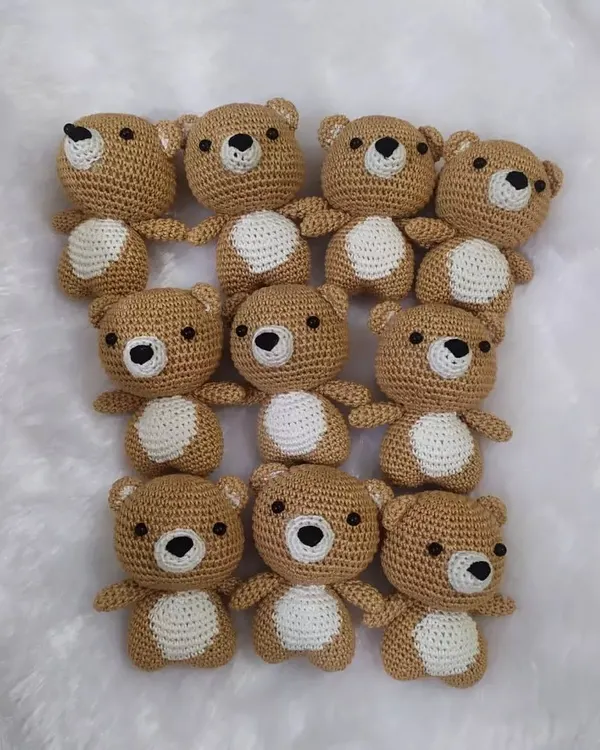 Ten little teddies all ready to go to their new home. I love making these in batches for parties. They are a sweet, handmade gift that guests will cherish.