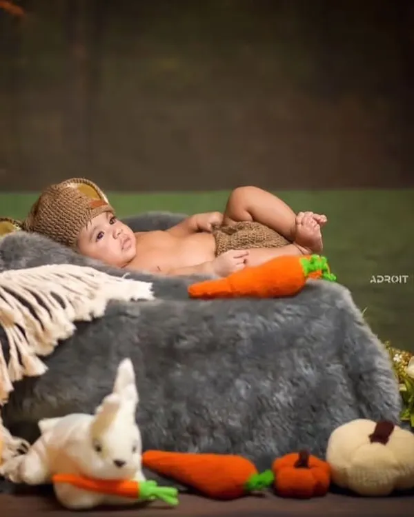 My crochet carrot and pumpkin amigurumi toys being used as props in a professional photoshoot. They add a touch of handmade charm and texture to the scene.