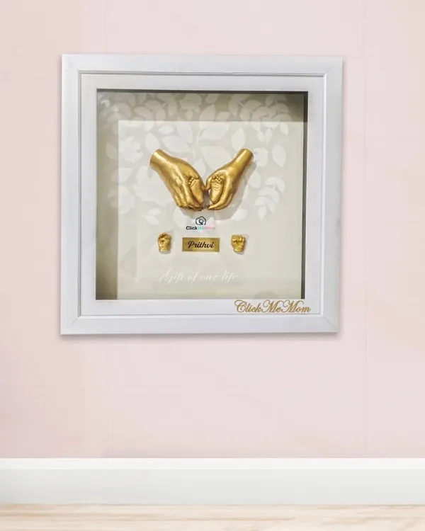 This is the moment I love to preserve forever. The feeling of your hands holding your baby’s, a symbol of protection and endless love, cast into a timeless 3D keepsake. This piece, with its delicate gold finish and elegant white frame, truly becomes the light of your life.