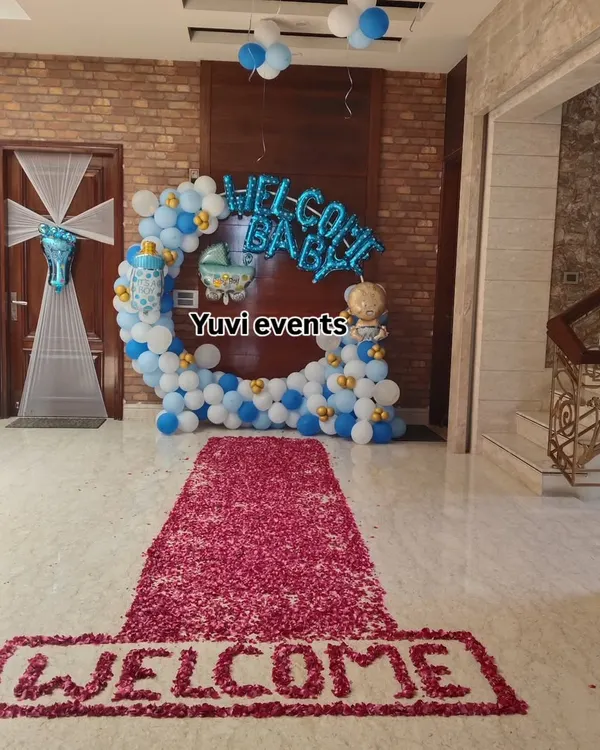 For this 'Welcome Baby' event, I created a grand entrance with a long carpet made entirely of red rose petals.