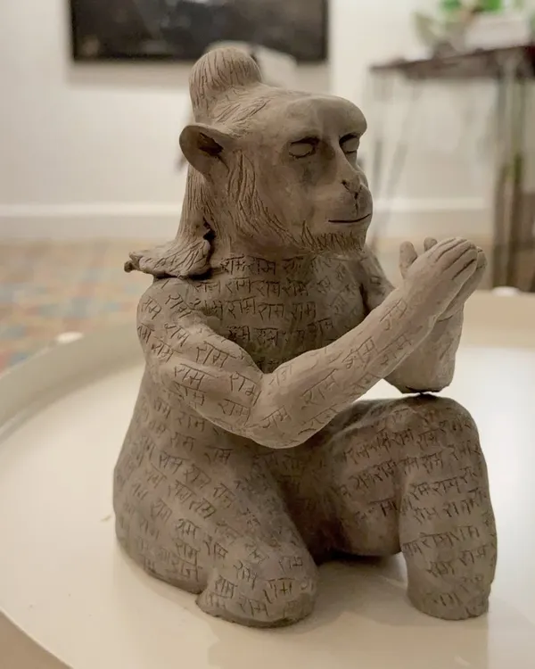 The Hanuman sculpture, after the initial sculpting and detailing. Here you can see the intricate calligraphy work I carved into the clay body before firing. This piece was a long journey of patience and shifting ideas.