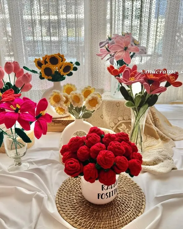 My collection of handmade crochet flowers, featuring red roses, bright sunflowers, and delicate lilies. These forever flowers are perfect for Valentine's Day, birthdays, or just because.