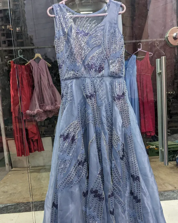 This organza blue handwork gown is perfect for an engagement. It comes with a detachable ball gown skirt, so you can have a grand entrance and a more relaxed look for dancing later.