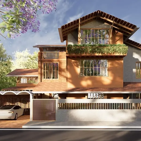 This home fuses vernacular and contemporary design, incorporating exposed brick and a sloping tiled roof for passive cooling. Large openings and a perforated brick screen ensure natural ventilation and privacy, reinforcing the home’s climate-responsive character.