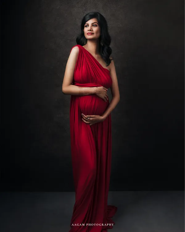 A portrait of pure elegance. This mother-to-be in a classic red gown embodies the strength and poise of motherhood. My fine art sessions are designed to create timeless art for your walls.