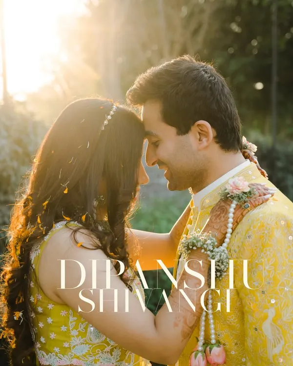 A beautiful close-up of a couple during their Haldi ceremony, illuminated by the golden hour sun. This image is all about warmth, love, and the beautiful traditions of a wedding.
