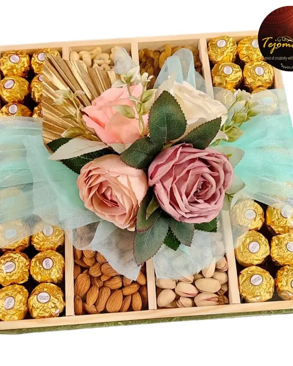 A premium gift hamper filled with Ferrero Rocher chocolates, almonds, and pistachios. Wrapped in love and delivered with grace, it's perfect for any celebration.